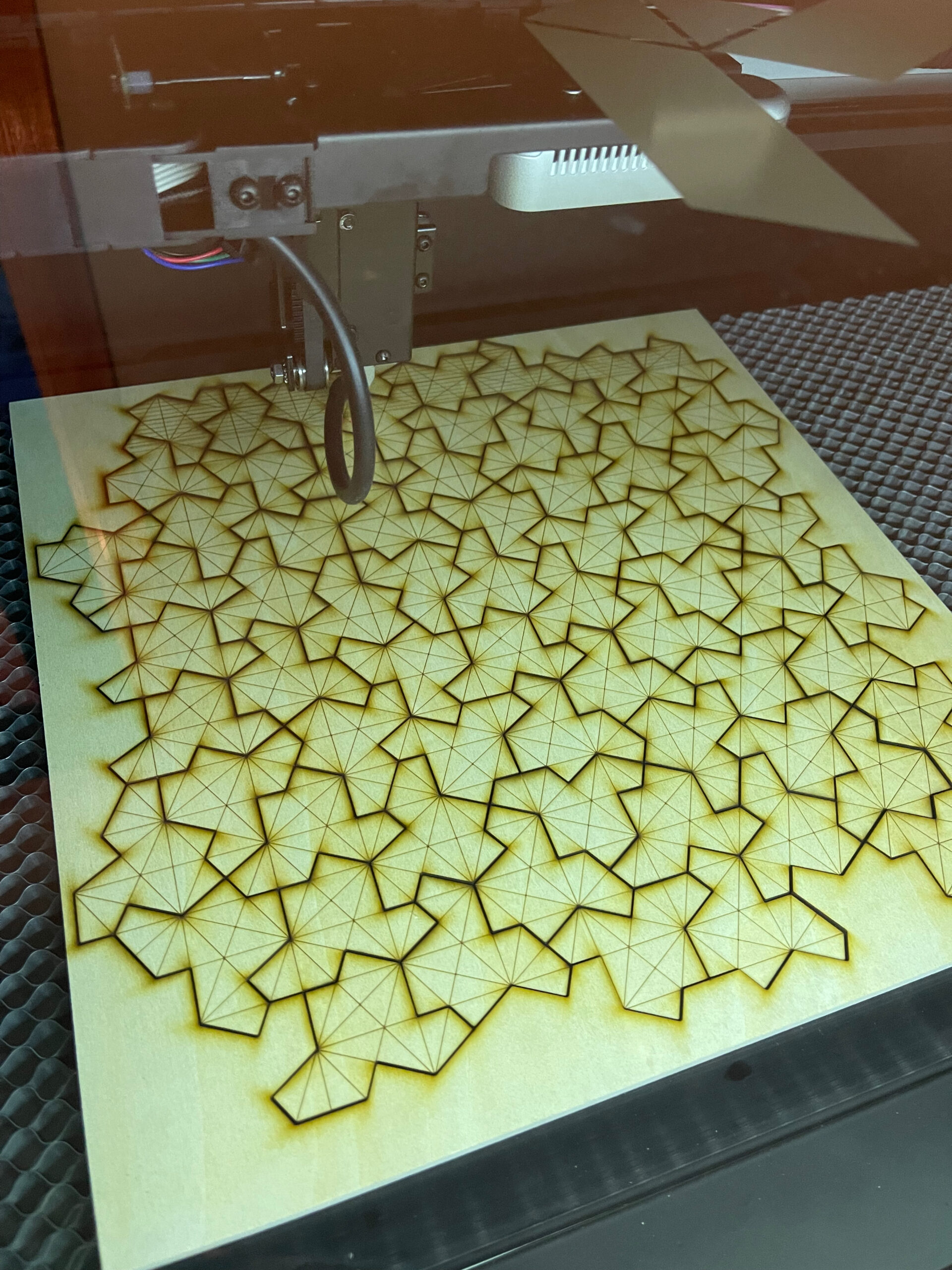 Full Spectrum Laser Muse 3D cutting Einstein tile shapes from wood sheet