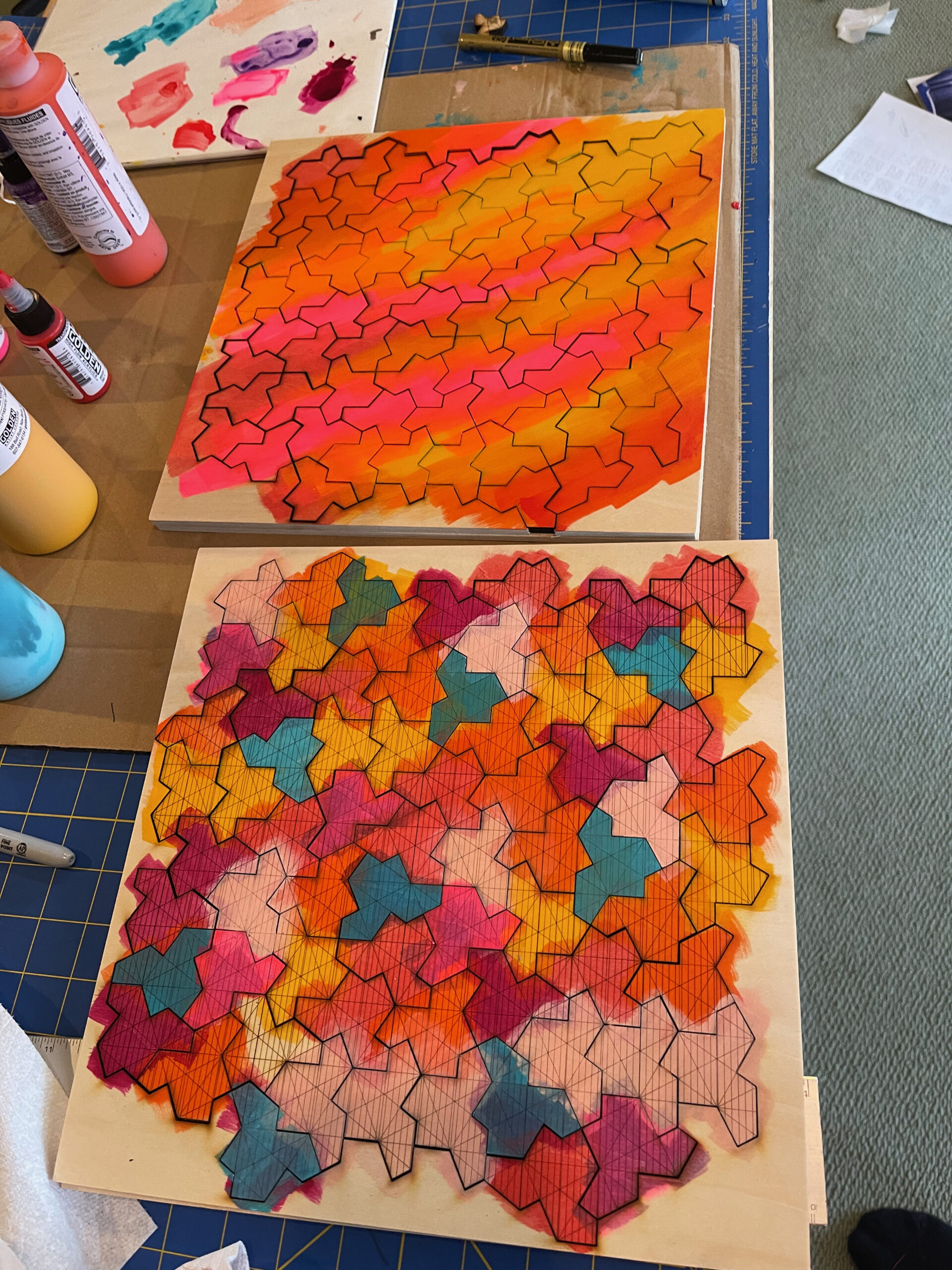 Two Einstein tile panels showing different painted colorways