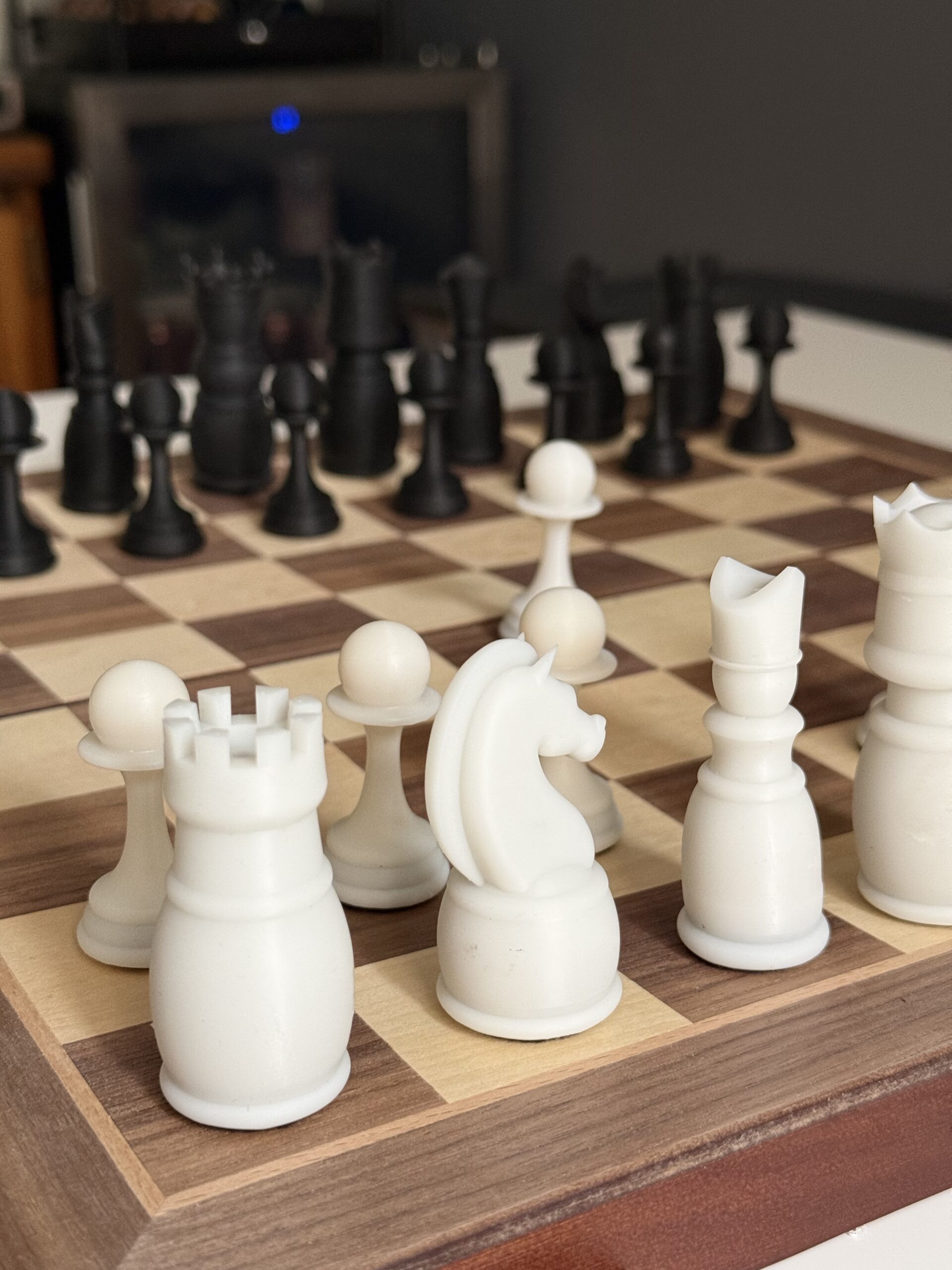 Close-up of white chess pieces showing piece detail