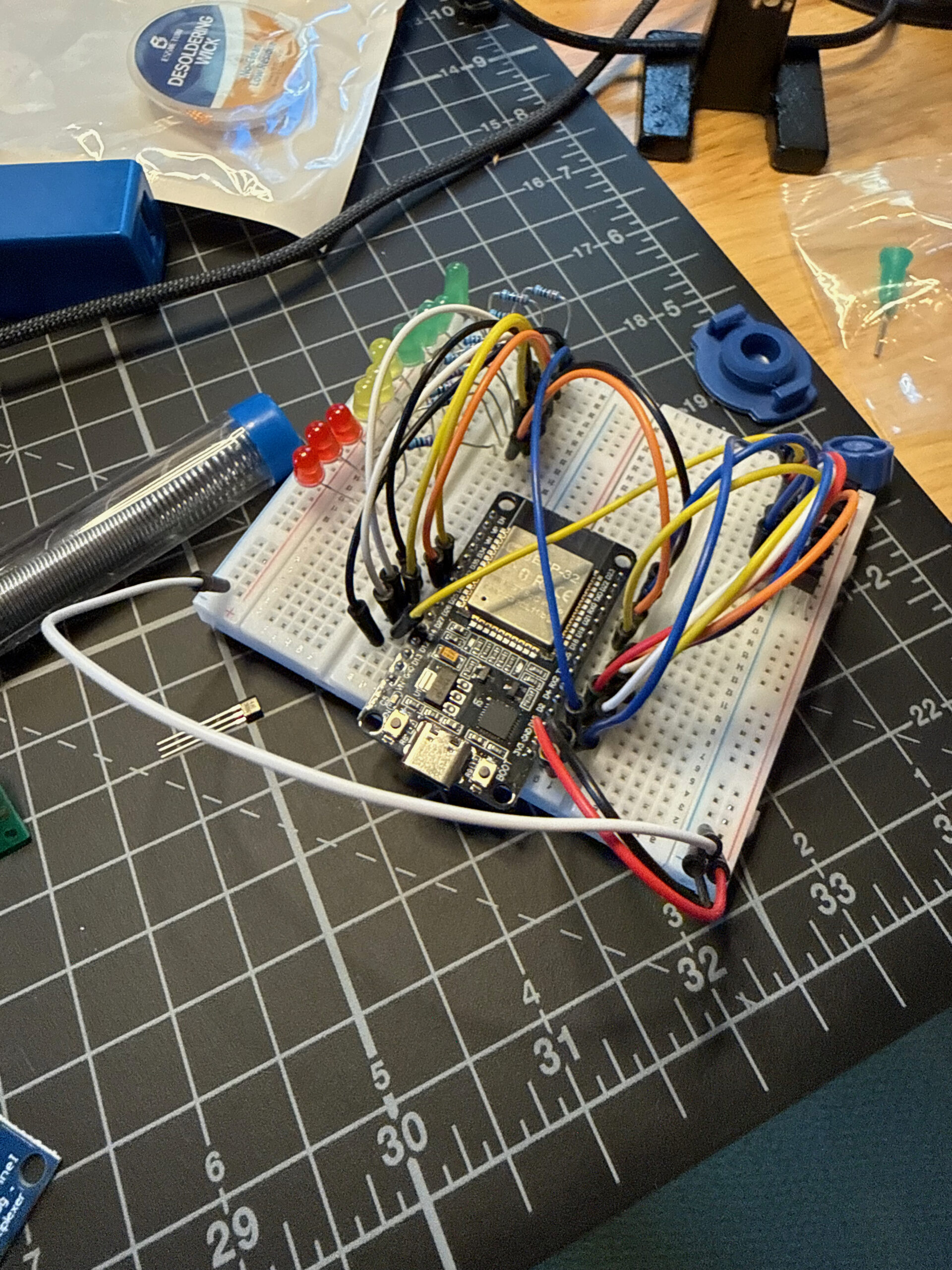 Wider shot of the breadboard with ESP32 and wiring