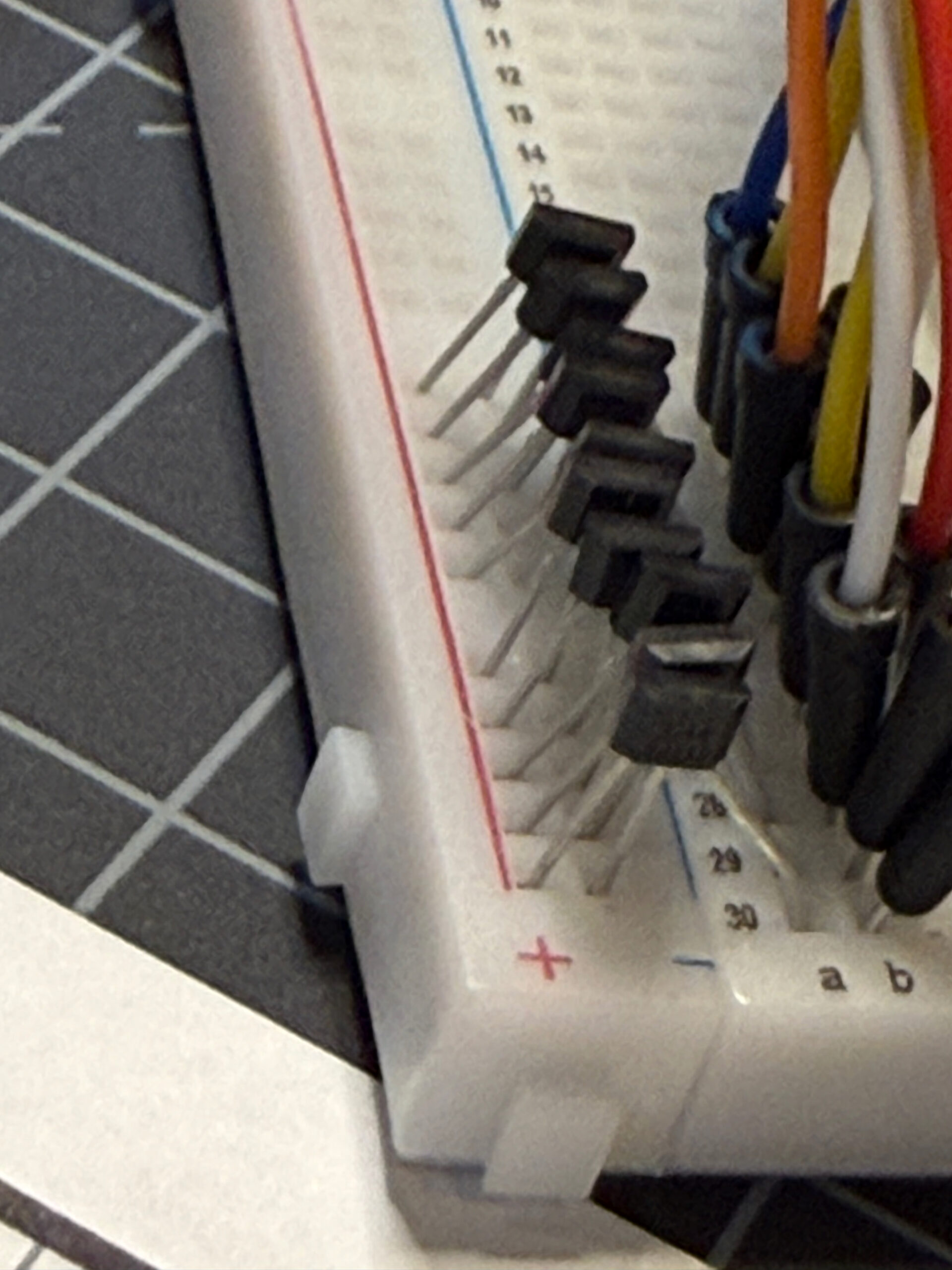 Close-up detail of the hall-effect sensor and breadboard rail